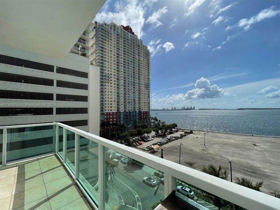 Panoramic view overlooking water and high-rise buildings.
