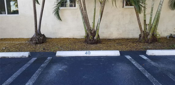 Outdoor parking lot with a designated parking space marked as number 40.