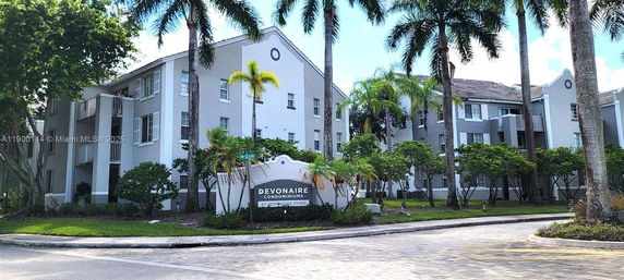 Front view of a multi-story condominium building.
