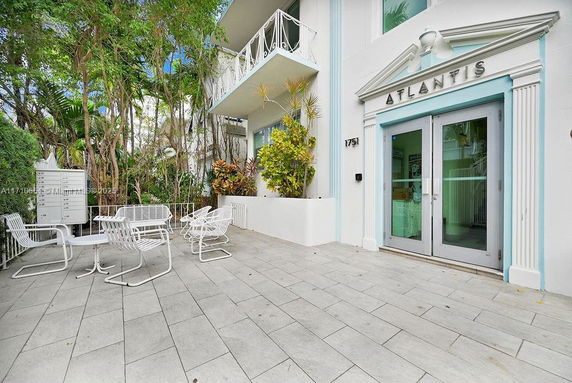 Front view of a building entrance with the name Atlantis above the doorway.
