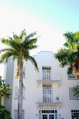 Front view of a multi-story building with balconies.