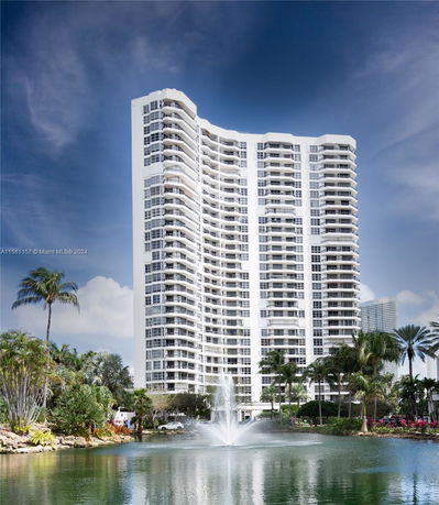 Front view of a high-rise residential building with several balconies.