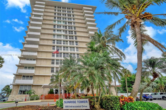 Front view of a high-rise building named Sunrise Tower.