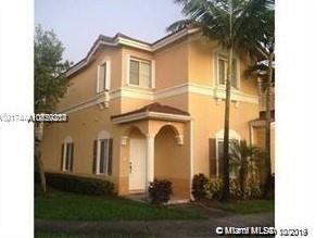 Front view of a two-story house with a small covered entrance.
