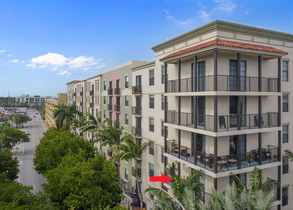 Exterior view of a multi-story apartment building with balconies.