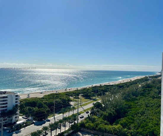Panoramic view of the ocean and coastline from a high vantage point.