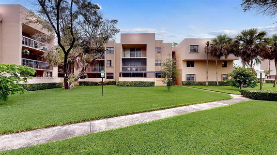 Front view of a multi-story building with balconies.