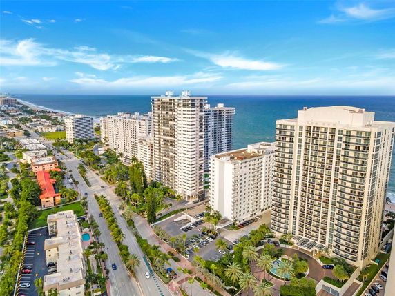 Aerial view of high-rise buildings along a coastal area.