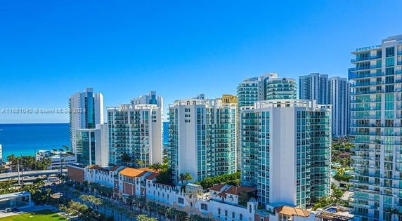 View of multiple high-rise residential buildings near the coastline.