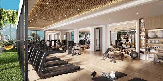Modern gym area with treadmills and weightlifting equipment