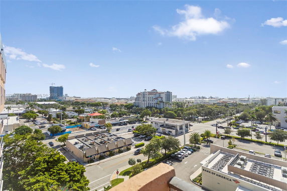 Wide angle view of urban area with multiple buildings and streets.