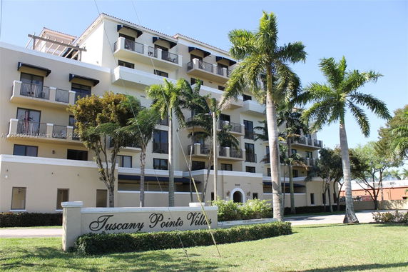 Front view of a multi-story residential building named Tuscany Pointe Villas.
