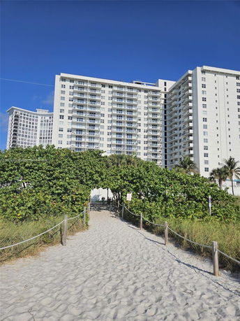 Front view of a high-rise building with balconies.