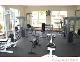 Interior view of a gym area with exercise equipment.
