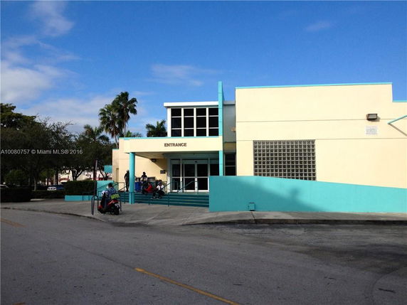 Front view of a large building with modern architecture and a visible entrance.