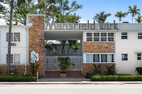 Front view of a building with a sign saying Mansfield Park.