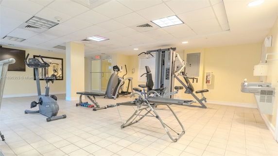 Indoor gym area with exercise equipment.