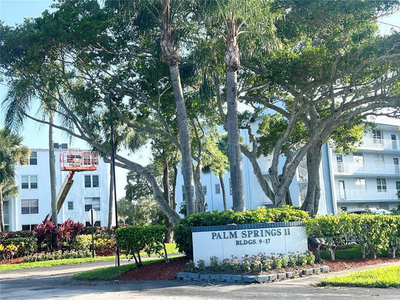 Front view of a residential complex with multiple buildings.