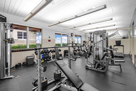 Interior view of a gym with various exercise equipment.