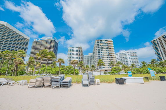 View of multiple high-rise buildings from the beach.