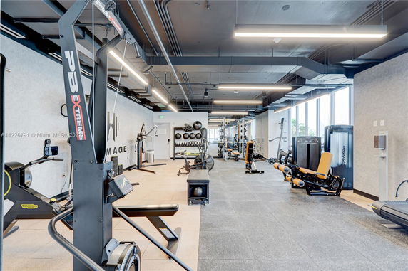 Interior view of a gym with various exercise equipment.