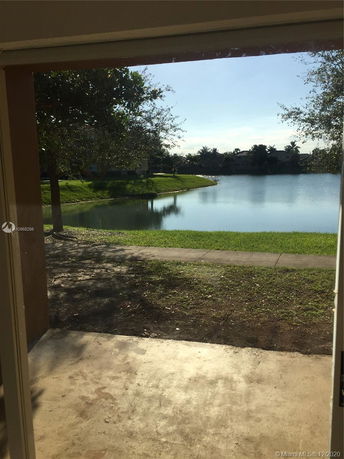 Scenic view of a lake and greenery from a building.