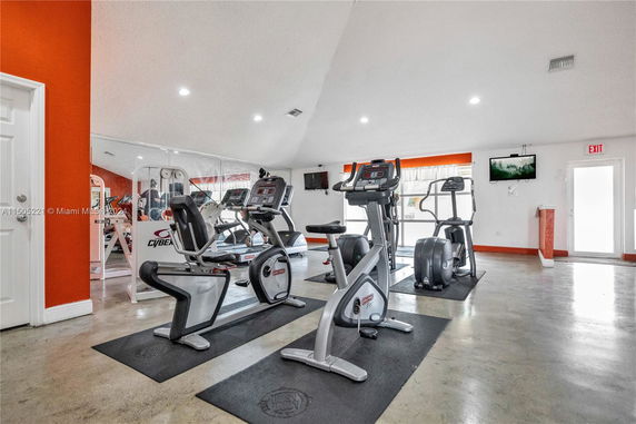 Interior view of a gym area with exercise equipment.