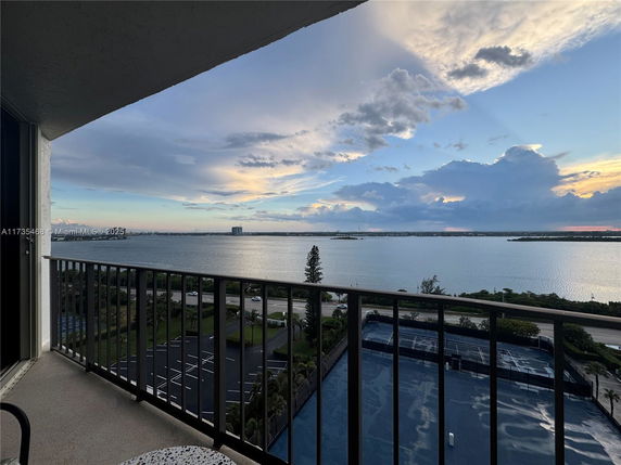Panoramic view from a building showing a wide-angle view of a body of water and distant horizon.