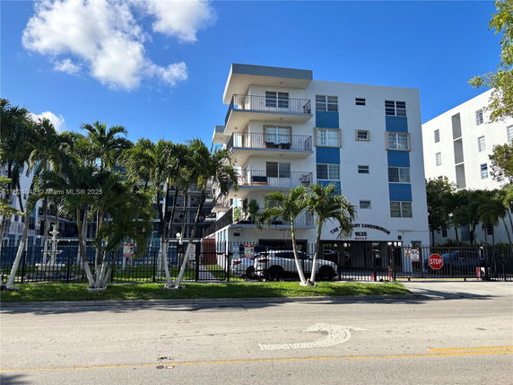 Front view of a multi-story condominium building.