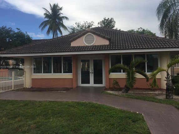 Front view of a single-story house with a tiled roof.