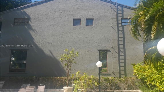 Front view of a building with multiple windows.