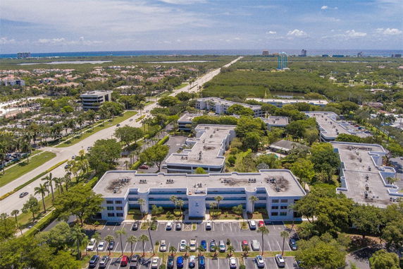 Aerial view of a cityscape with buildings and roads.