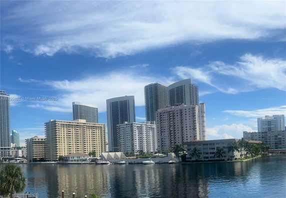 View of several high-rise buildings near a body of water.