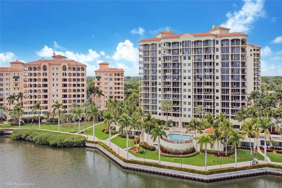 Front view of a multi-story residential building with balconies.