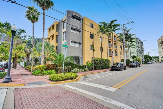 Front view of a multi-story residential building with a modern facade.