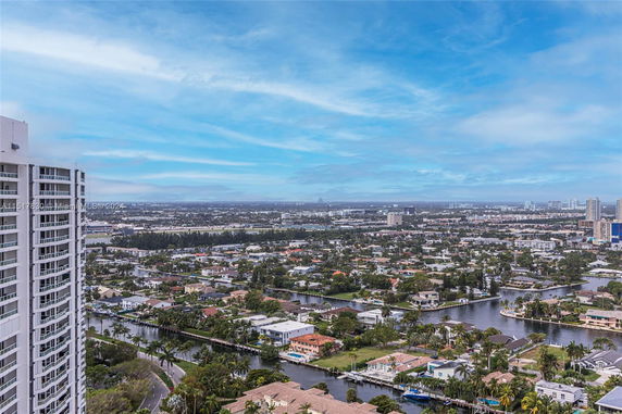 Panoramic view of cityscape with buildings and waterways.