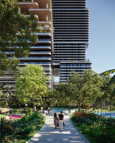 Front view of a modern multi-story building with unique architectural design.