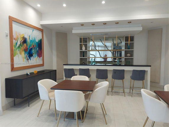 Indoor recreation area with modern decor and seating arrangements.