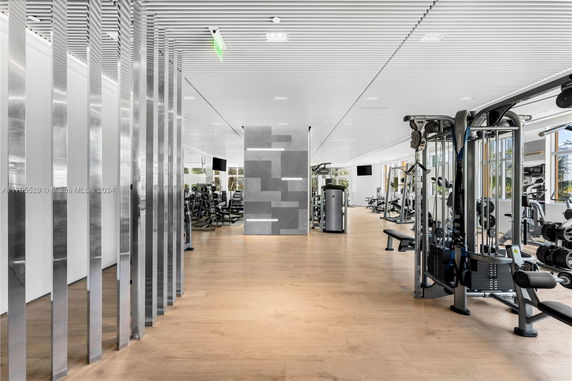 Interior view of a modern gym area with fitness equipment.