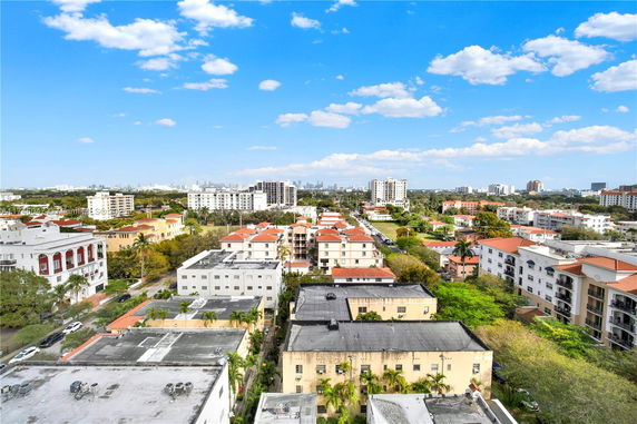 Aerial view of a residential area with multiple apartment buildings and greenery.