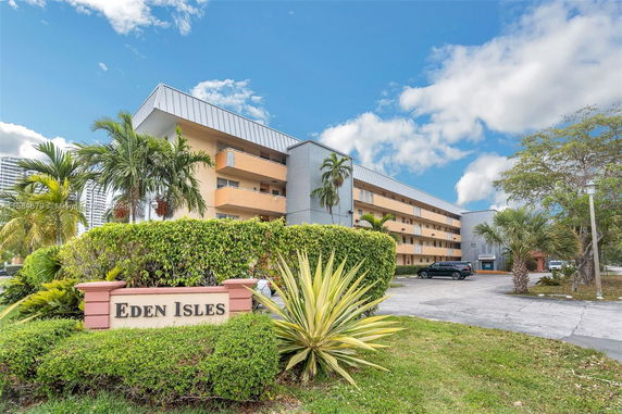 Front view of a multi-story residential building named Eden Isles.
