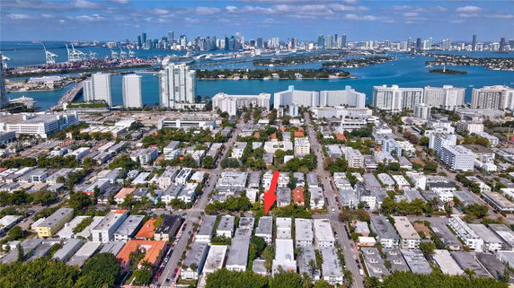 Panoramic view of a cityscape with high-rise buildings and waterways.