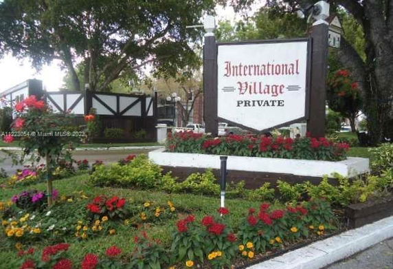Signboard at the entrance of a residential complex named International Village.