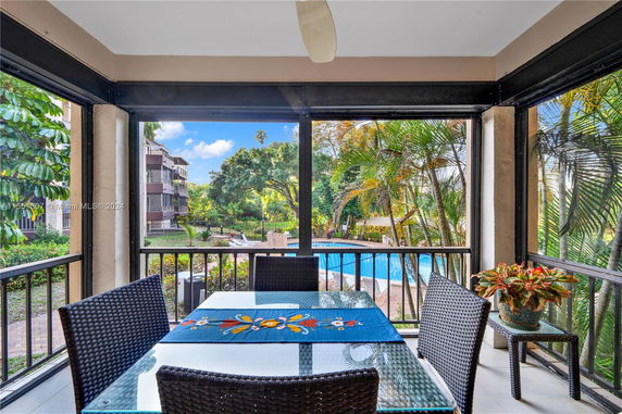 View of pool area and garden from a balcony.