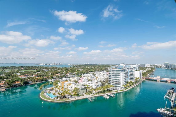 Panoramic view of a coastal area with buildings and water.