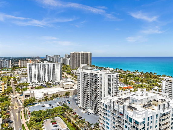Panoramic view of city buildings and coastline.