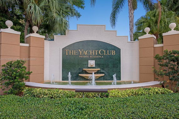 Front view of entrance sign for The Yacht Club private residence.
