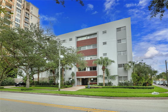 Front view of a mid-rise residential building with modern design.