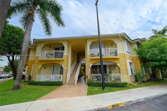 Front view of a two-story building with balconies.