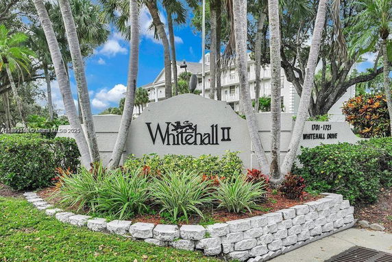 Front view of a residential building with a sign that reads 'Whitehall II'.